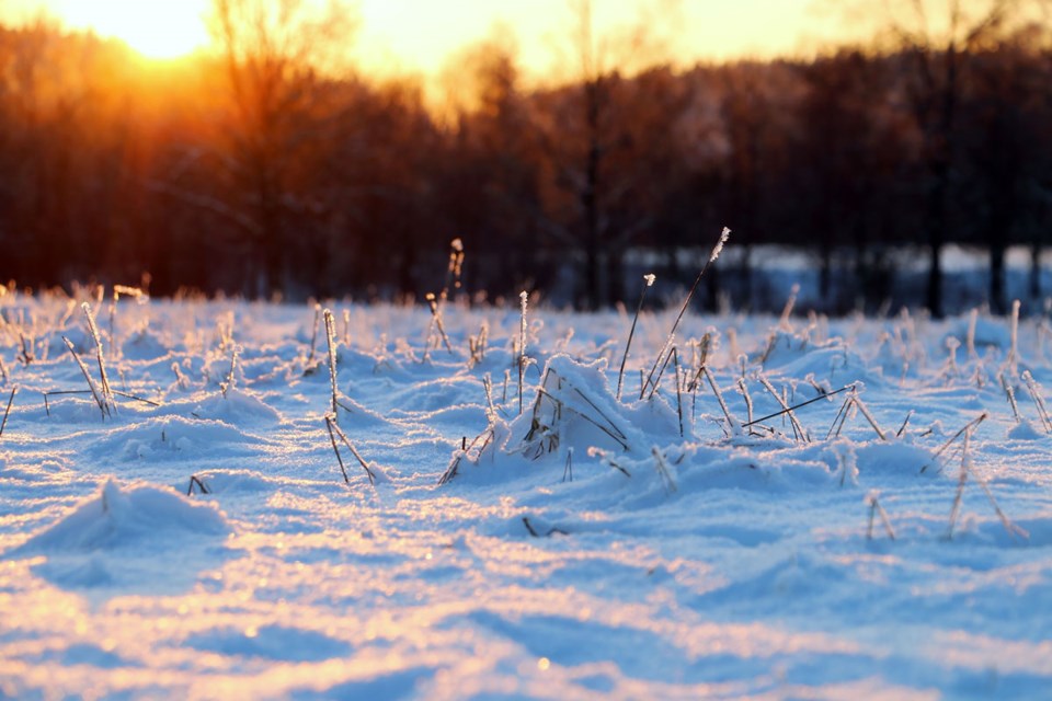 Solnedgang og snø